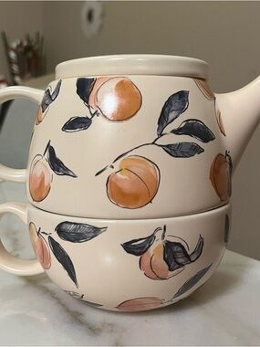 Peach patterned teapot and teacup